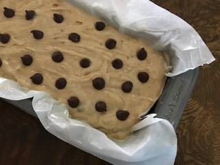 bread topped with chocolate chips ready to be baked