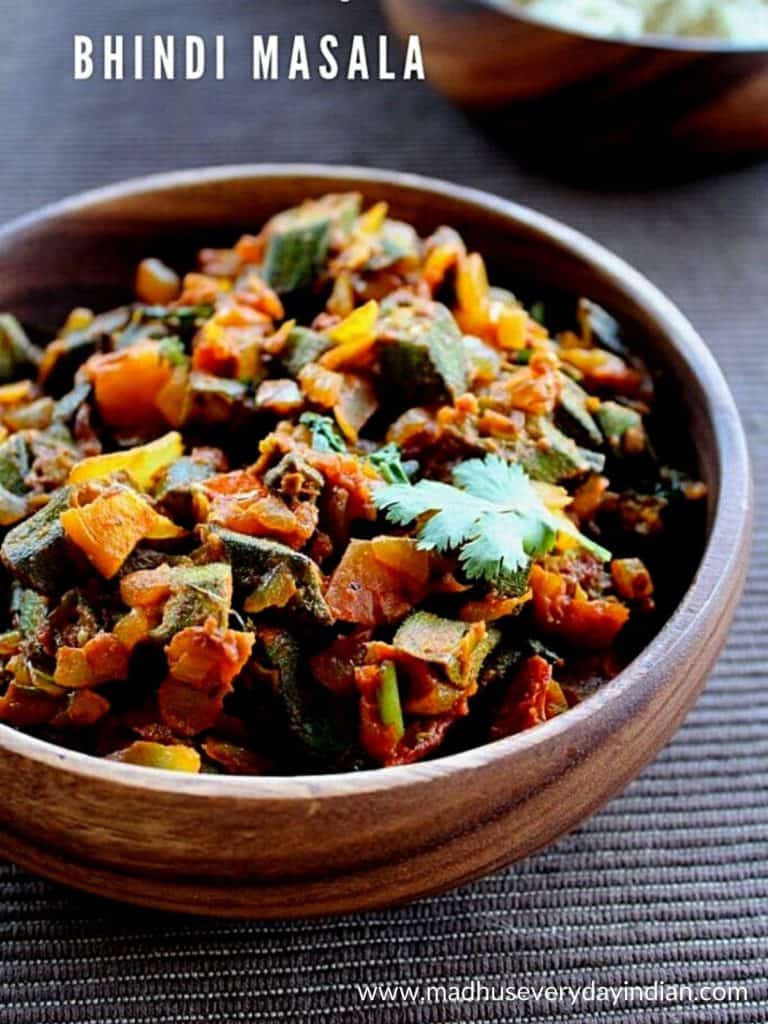 bhindi masala served in a wooden bowl.