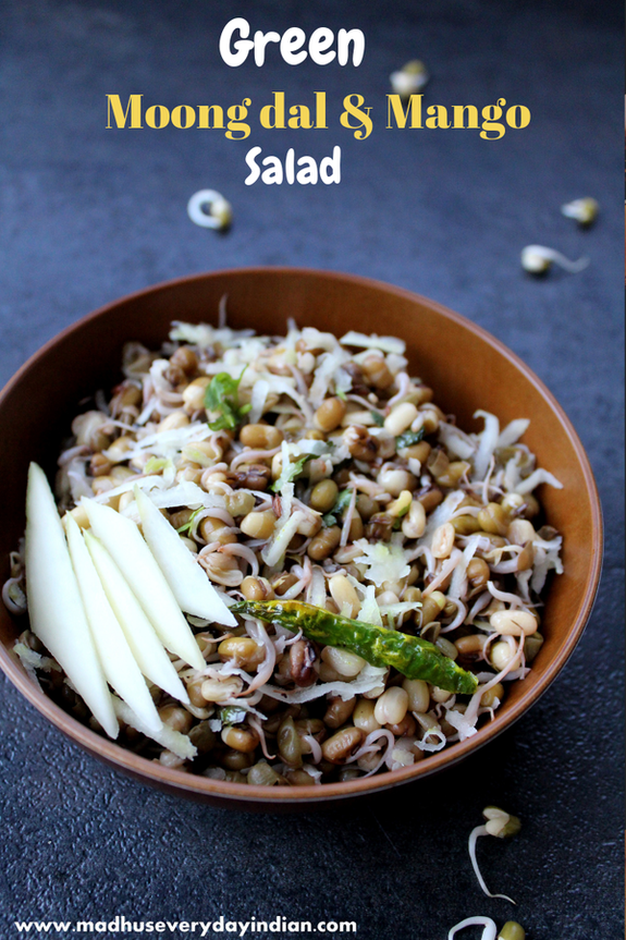 sprouted green moong dal salad topped with green mango