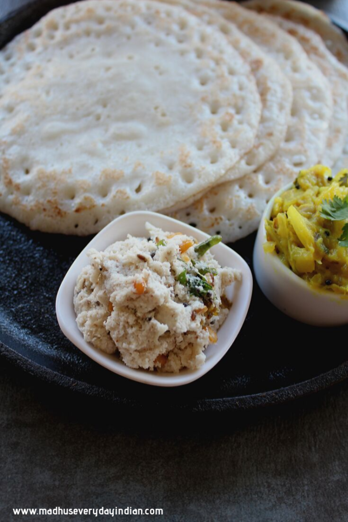 coconut chutney served with poha dosa and potato curry