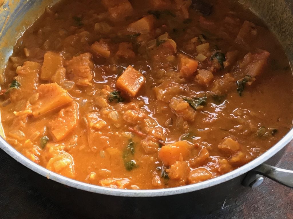 pumpkin curry ready to serve in a steel sauce pan