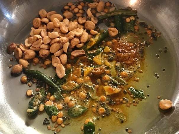 tempering with peanuts, turmeric and asafoetida