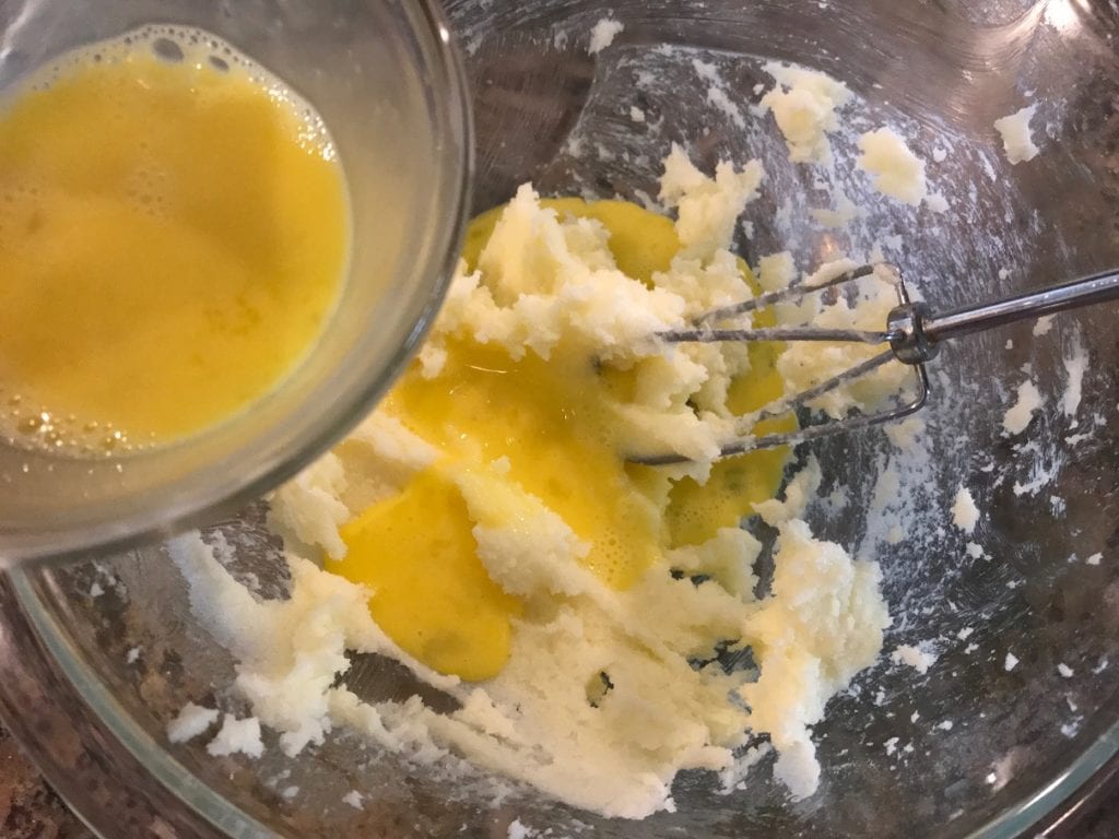 adding egg to the creamed butter and sugar