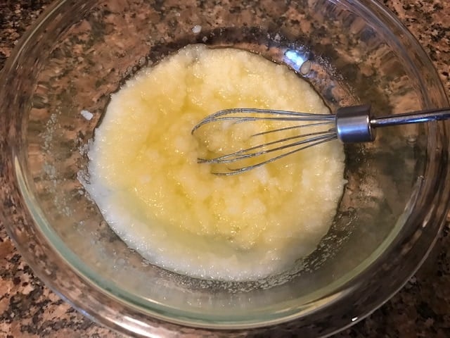 whisking sugar in the butter to make brownies