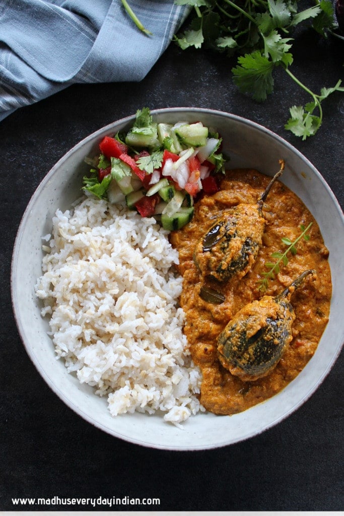 stuffed brinjal curry served with rice and salad