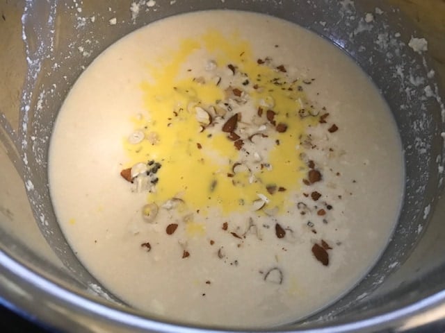 saffron milk and nuts added to sweetened milk