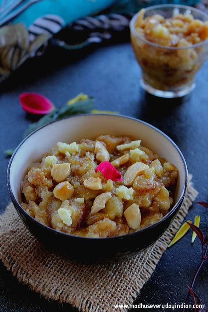 bread halwa served in a black bowl with cashew