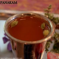 panakam served in a silver cup with cardamom