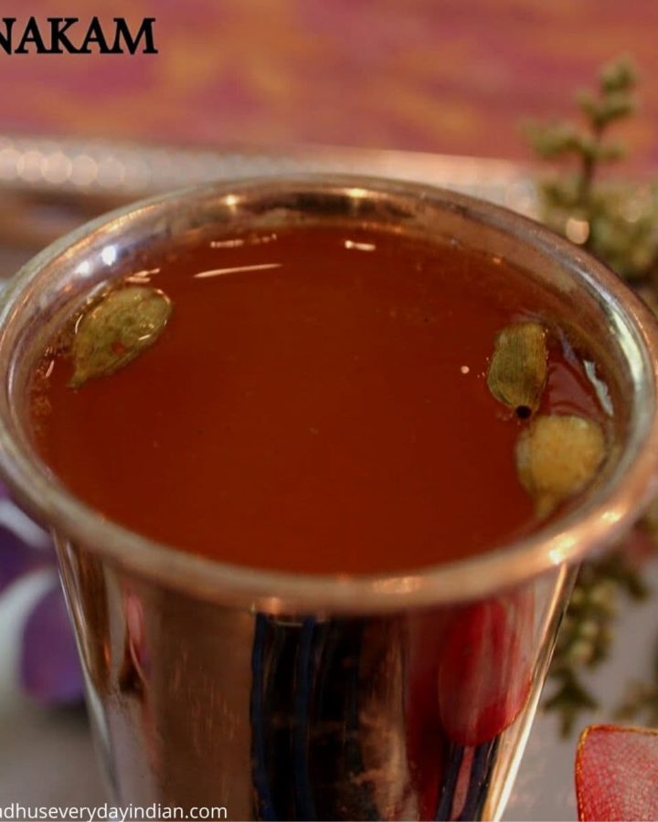 panakam served in a silver cup with cardamom