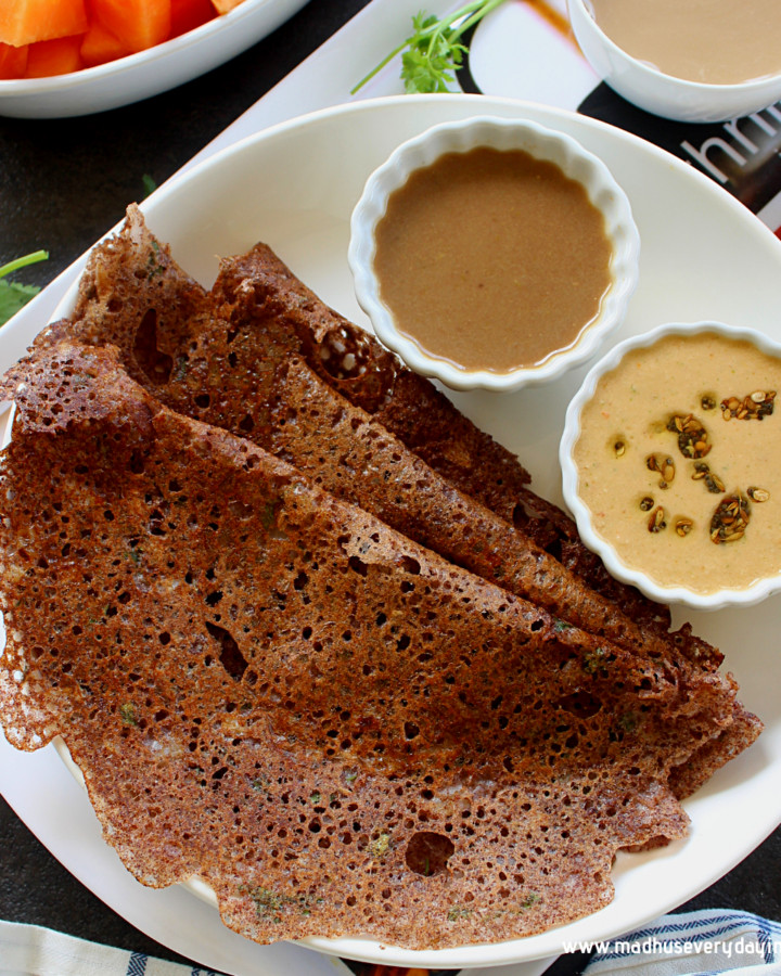 ragi dosa served in a white place with chutney and coffee