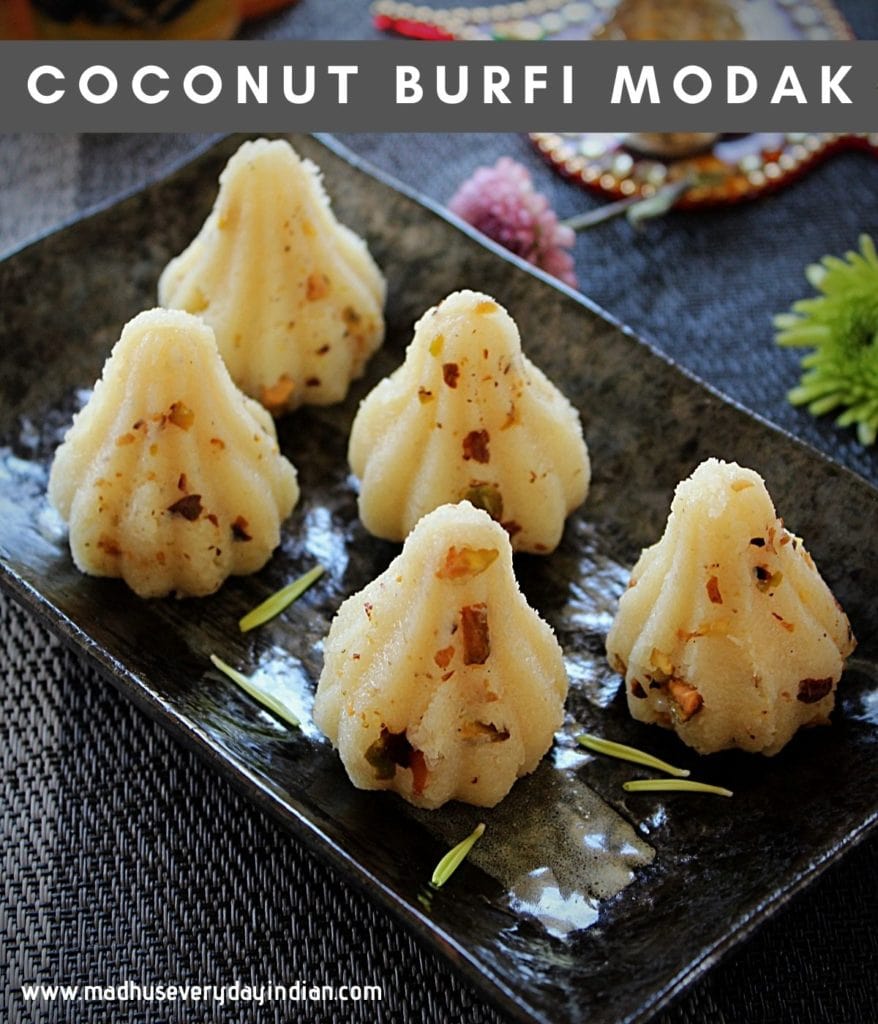 coconut burfi modak served in a black plate