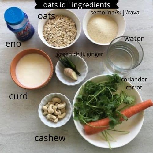 oats, rava, curd,eno,water,ginger,green chili, carrot and coriander arranged in a white back ground
