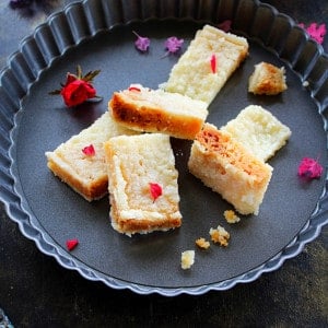 milk cake pieces garnished with rose petals