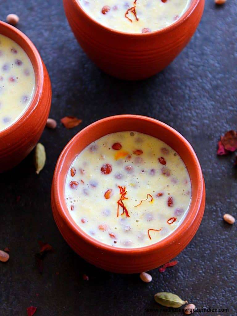 badam milk served in clay pots served with nuts and saffron