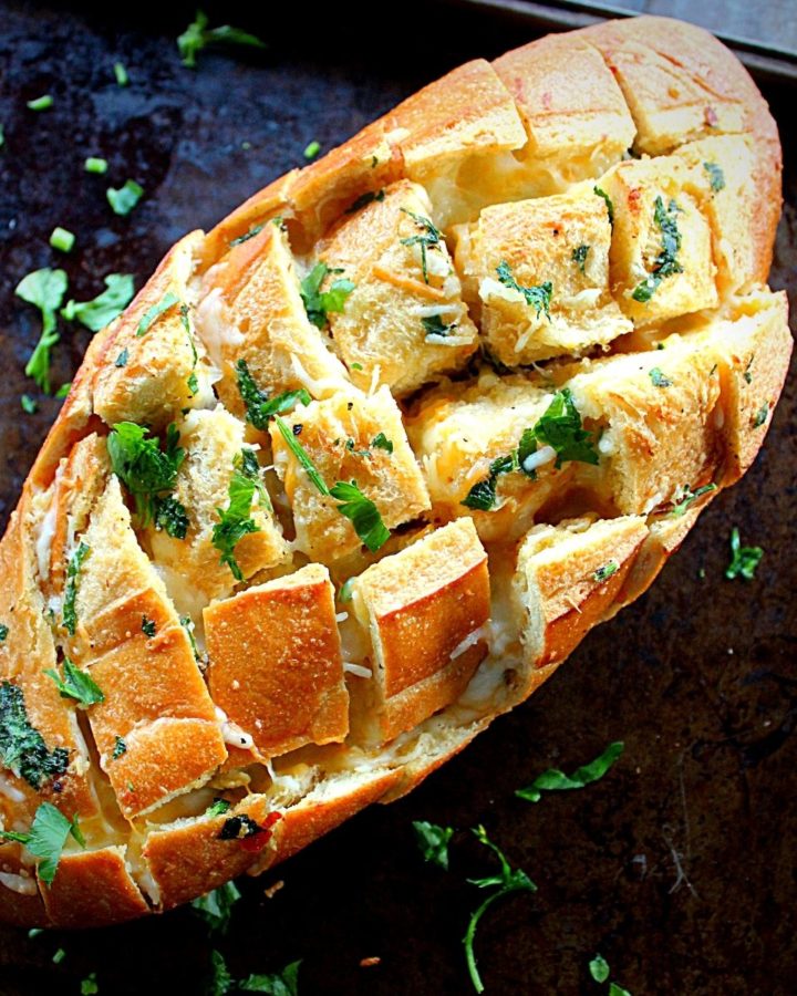 pull apart bread with garlic and cheese baked till crisp and served with chopped fresh parsley