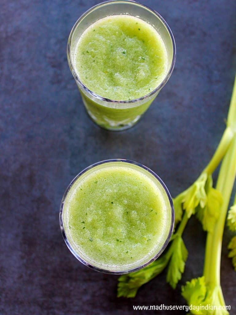 detox celery smoothie served in two glass cups