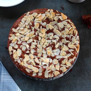 eggless almond cake topped with slivered almonds