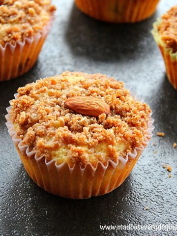 almond flour muffins topped with streusel topping and whole almonds