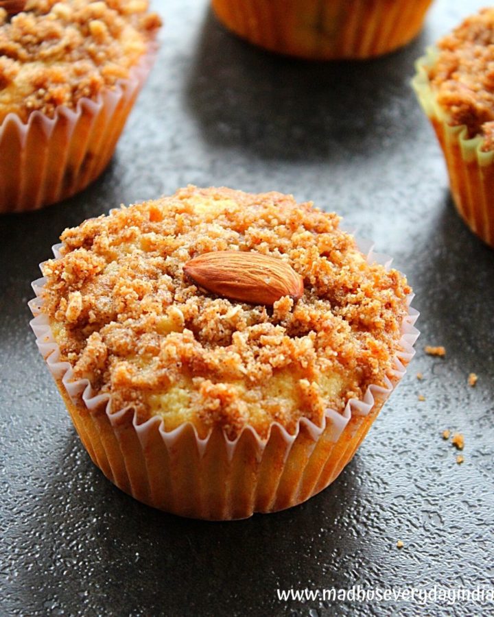 almond flour muffins topped with streusel topping and whole almonds