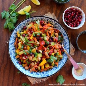 boiled peanut chaat served in a colorful bowl, with pomegranate and other chutneys.