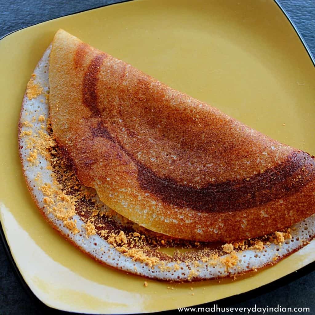 podi dosa served in a yellow plate