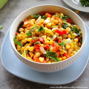indian corn salad served in a large white bowl.