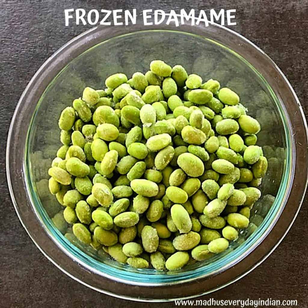 frozen edamame placed in a glass bowl