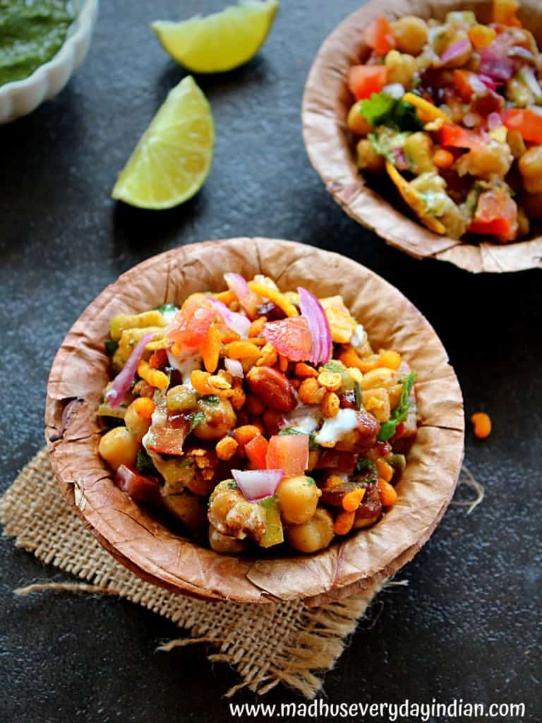 chole chaat served in a dry leaf bowl with lime