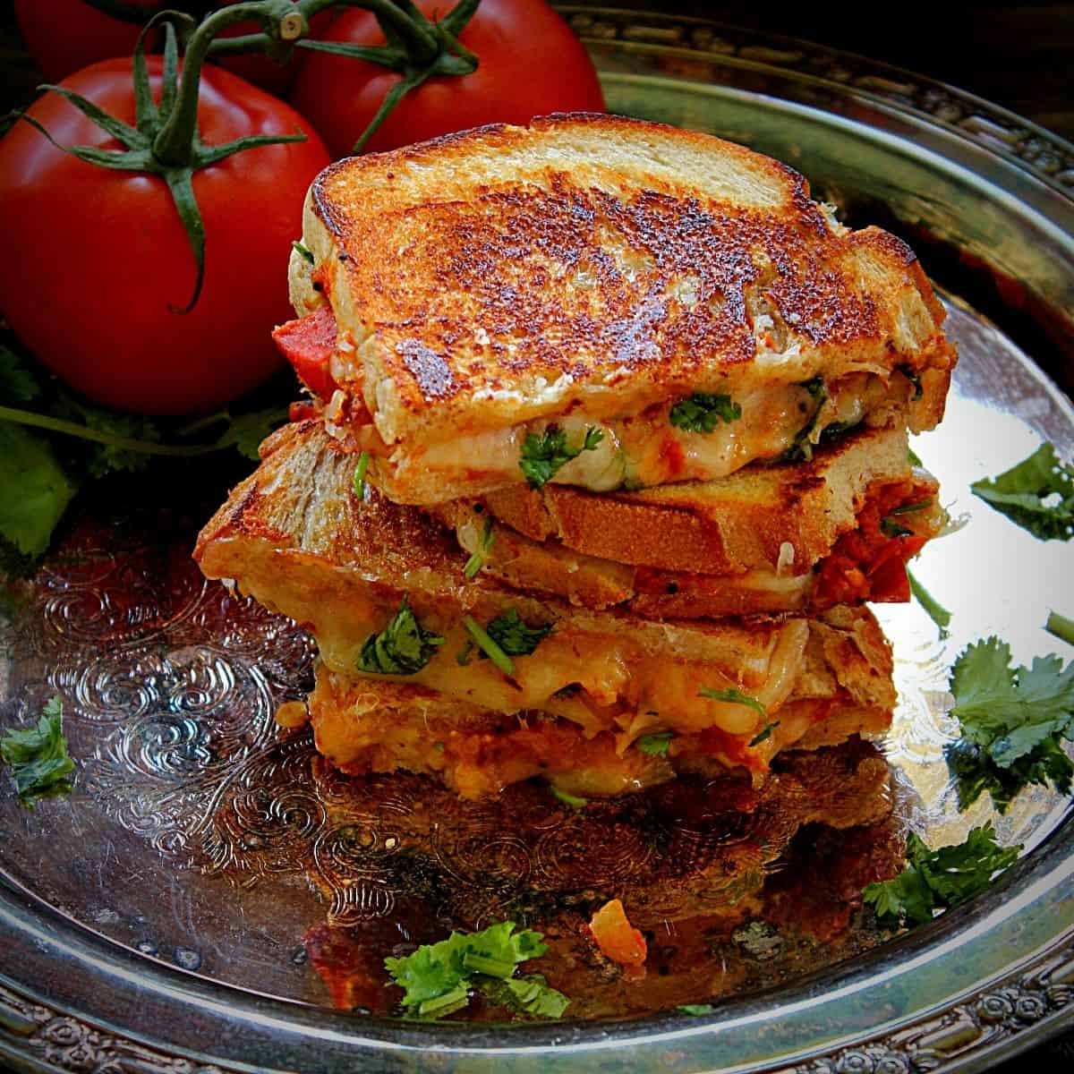 https://www.madhuseverydayindian.com/wp-content/uploads/2021/06/tomato-chutney-grilled-cheese-sandwich.jpg