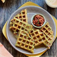 5 green moong dal waffles served with onion chutney