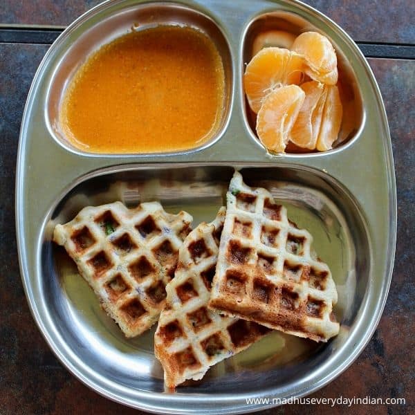 dosa waffles erved with chutney podi and orange