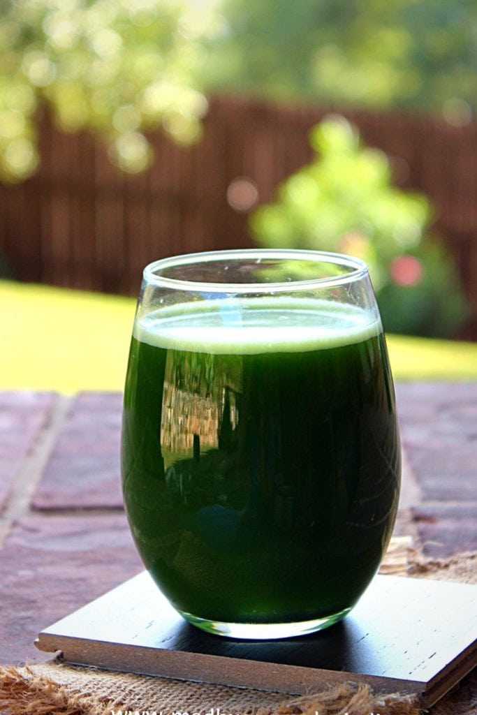 ash gourd green juice served in a large glass cup