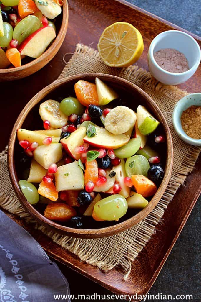 fruit chaat served in a wooden bowl 