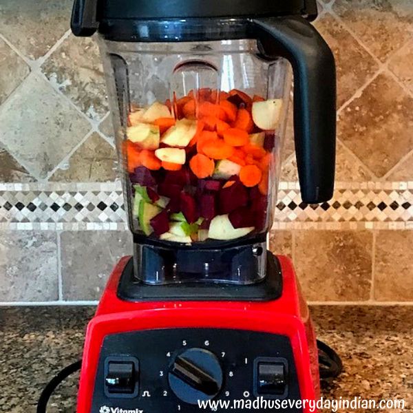 fruits and veegies added to  a vitamix blender