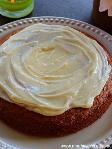 simple carrot cake topped with velvety cream cheese frosting