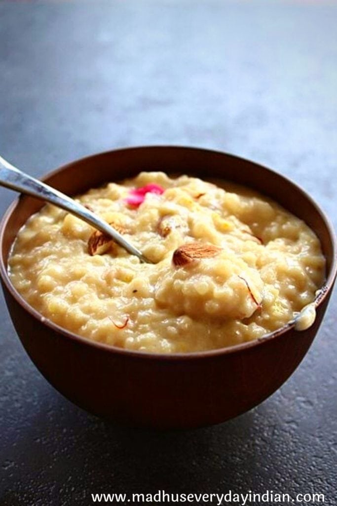 instant pot rice kheer served in a wooden bowl with spoon