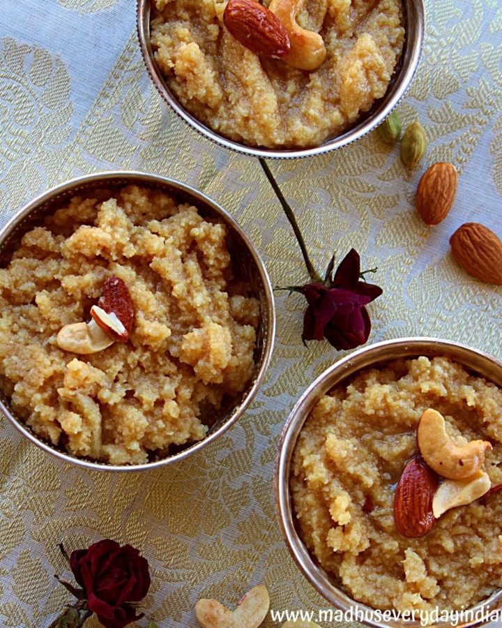 3 cups of khus khus halwa arranged in silver bowls garnished with nuts