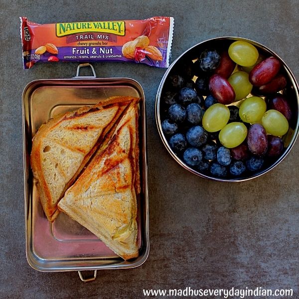 potato sandwich, blue berry, grapes and granola bar in the pic