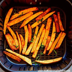 masala fries air fryer garnished with cilantro