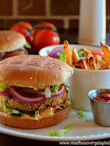 indian style veggie burger served with masala fries and ketchup