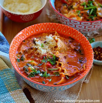 vegetarian lasagna soup served in two bowls garnished with parsley and parmesan cheese