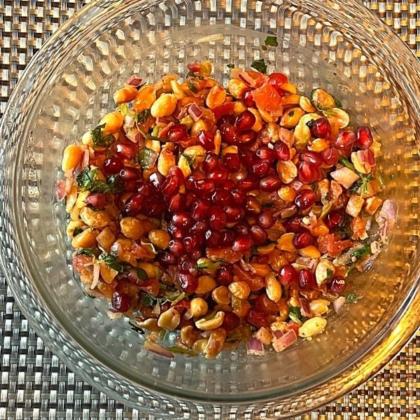 pomegranate seeds added to the peanut salad
