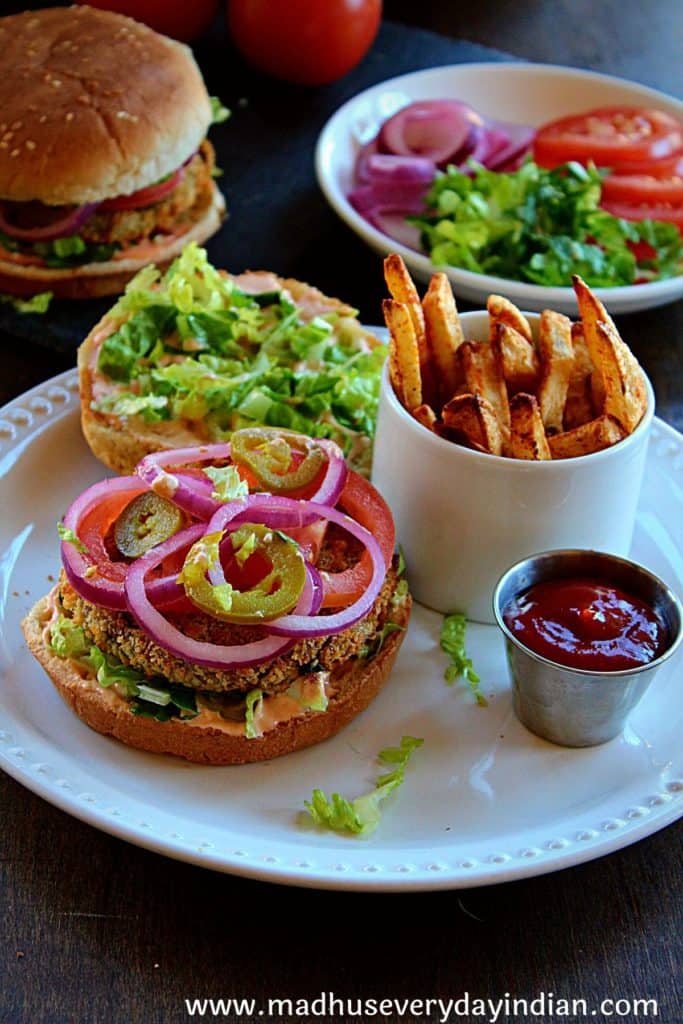veggie burger with onion, tomato and jalapeno and served with fries and ketchup