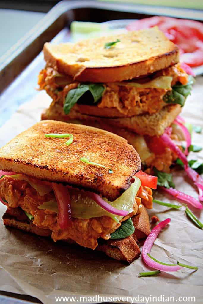 spicy chickpea sandwich served on a parchment paper