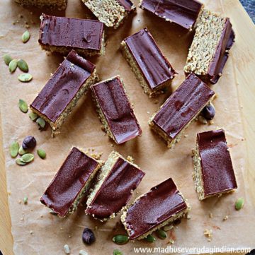no bake cookie dough bars lined on a brown parchment paper