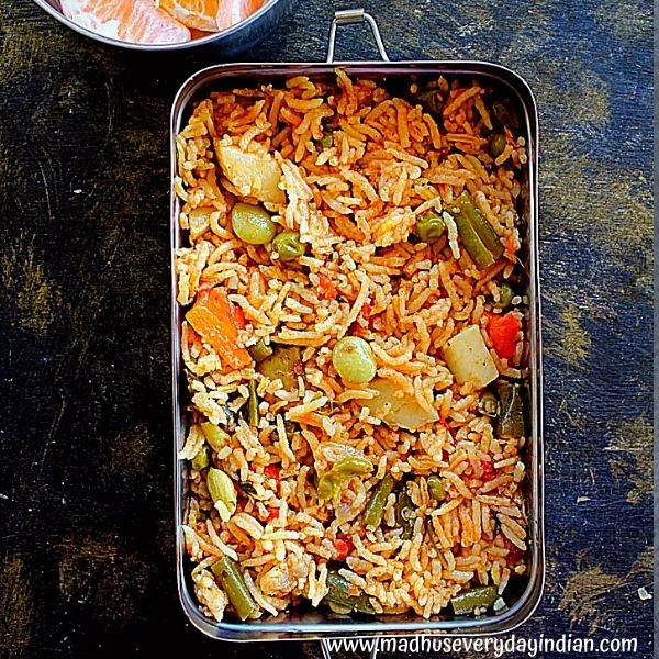 vegetable pulao served in a steel lunch box
