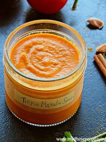 tikka masala sauce served in a glass container