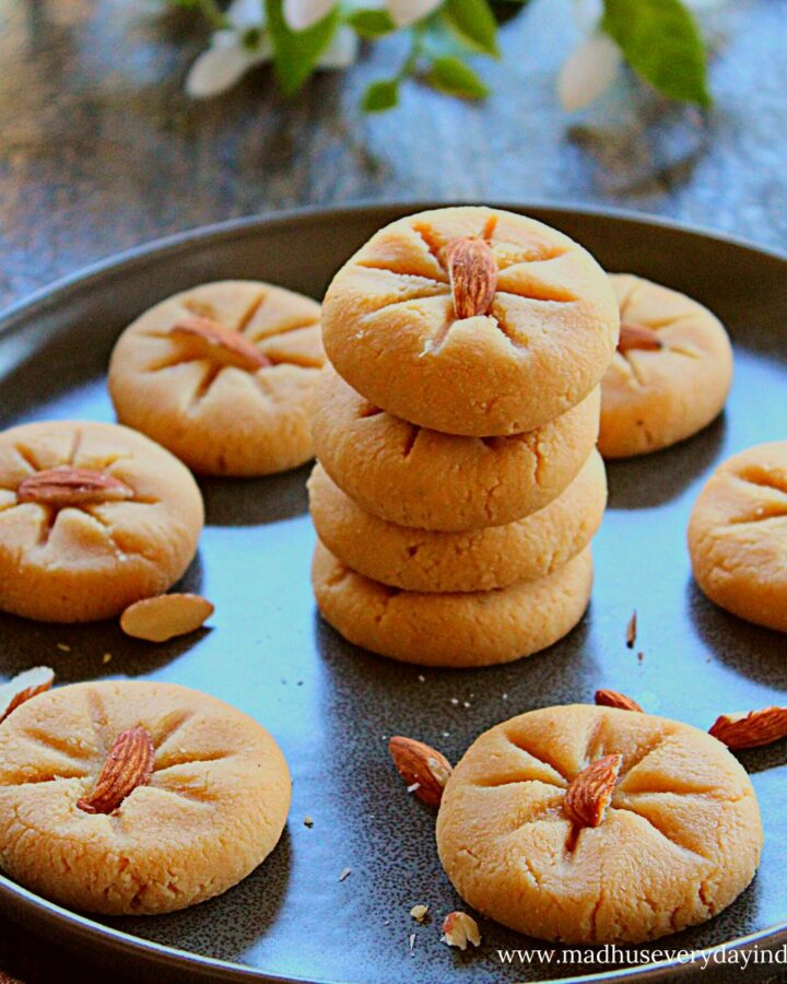 badam peda stacked on top of each other in a dark grey plate