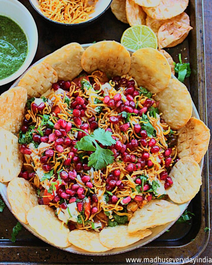 chaat dip served with papdi , sev and chutneys