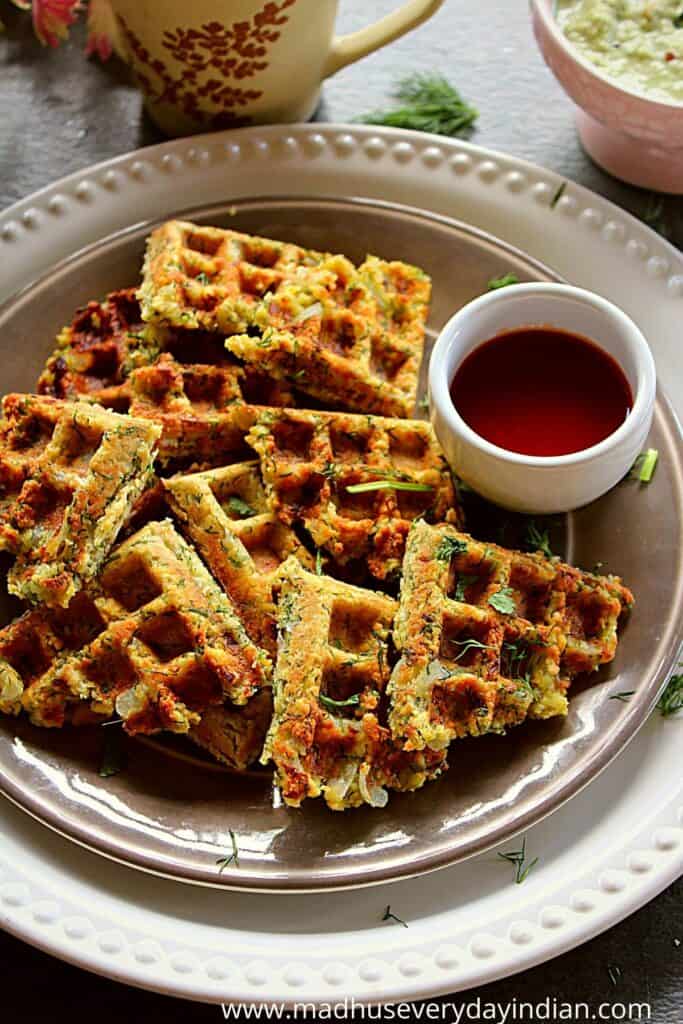 masala vada waffled serving in a plate with maggi sweet and spicy sauce